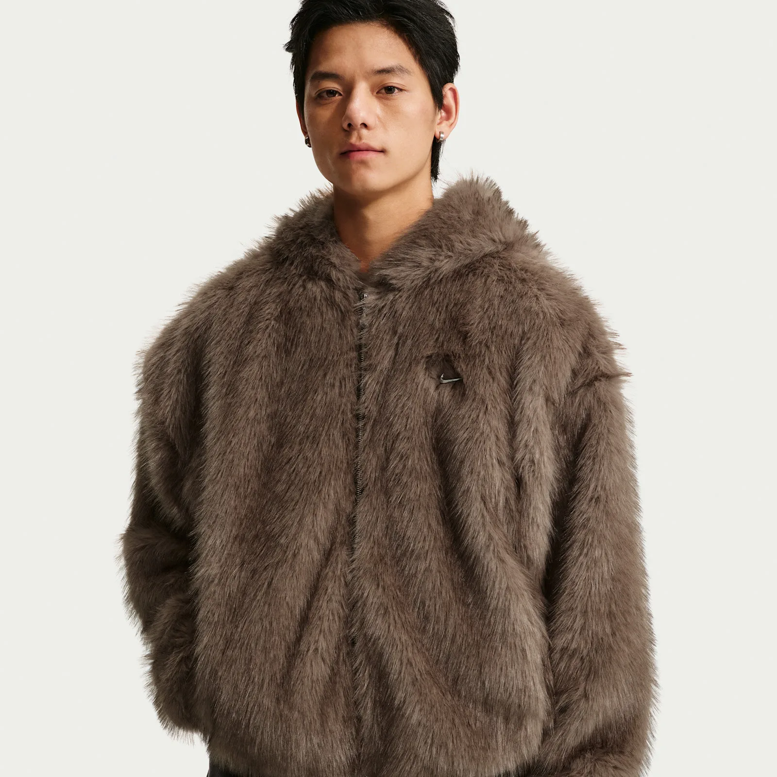 front detail with hood down, showing small Nike swoosh pin on chest, Faux Fur Jacket