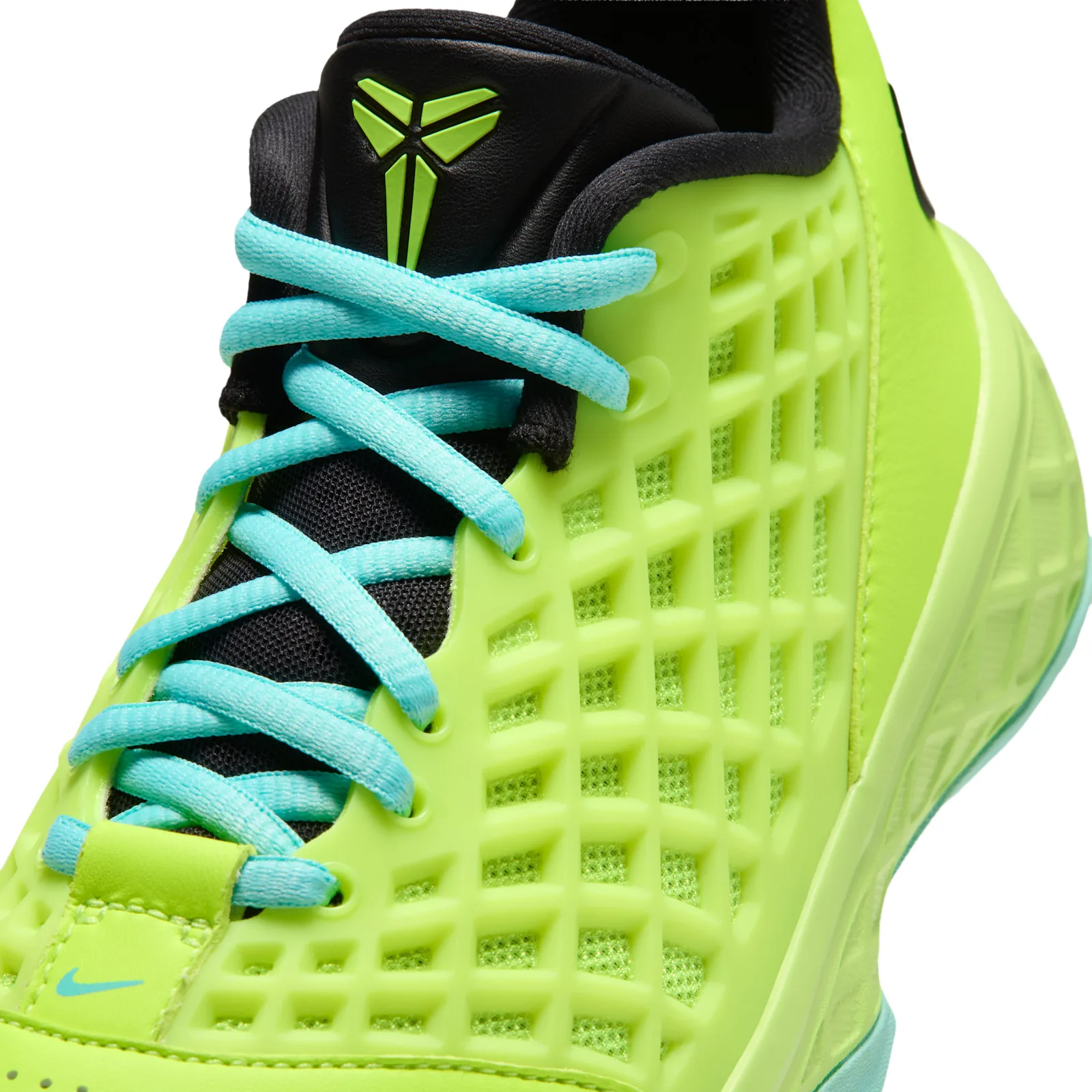 Close-up of toe and eyelets, aqua laces crossed over black tongue with Kobe logo, Mismatch