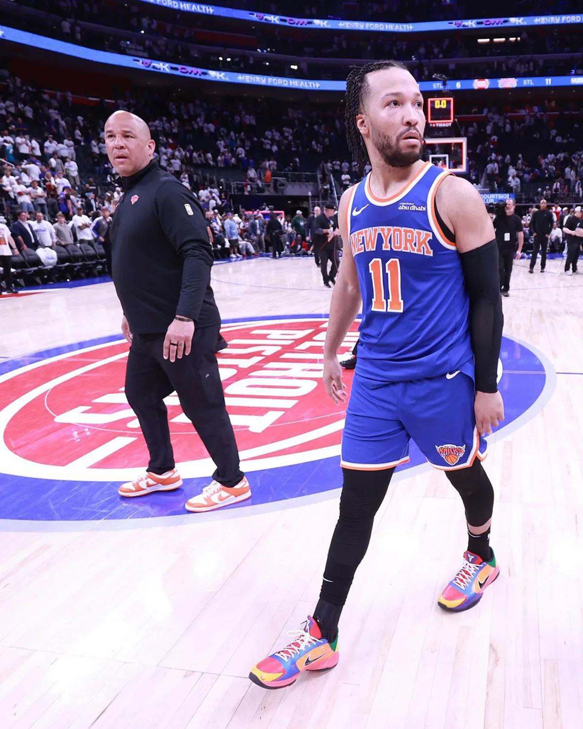 on-court action shot, player wearing multicolor pair with pink outsole on wood floor, What The Rick