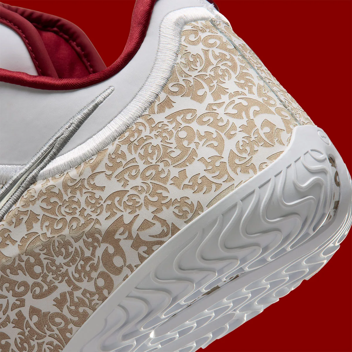 close-up of heel counter showing gold paisley pattern texture, Laser