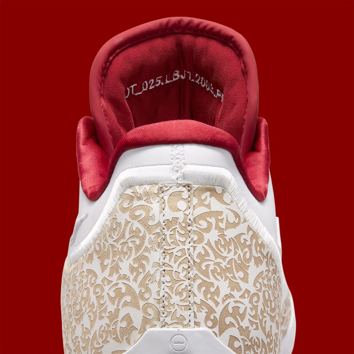 close-up of heel tab and tongue with stitched text on red lining, Laser