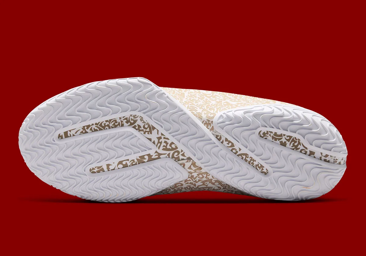 outsole view showing white tread with gold paisley print inserts, Laser
