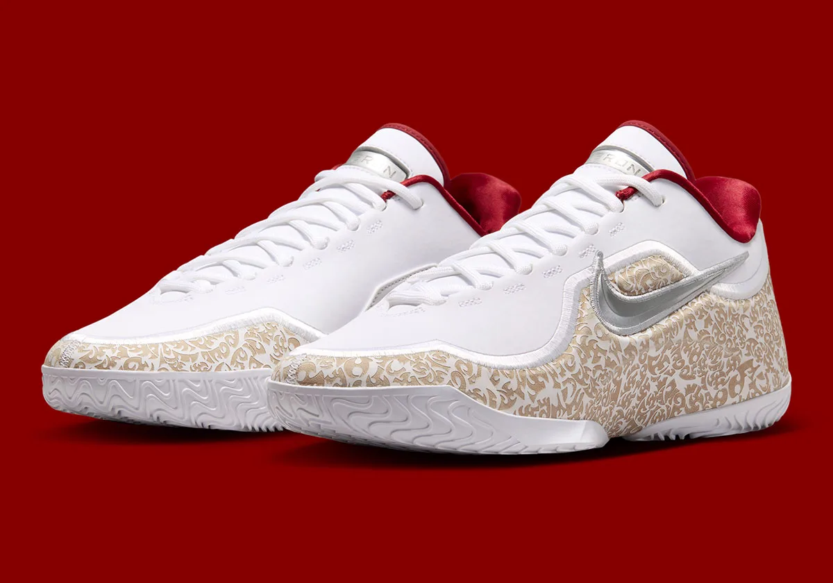 front three-quarter pair view on red background, dark red tongues visible, Laser