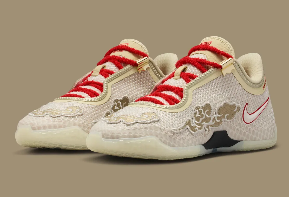 front three-quarter view of the pair, red laces and gold eyelets, Lunar New Year