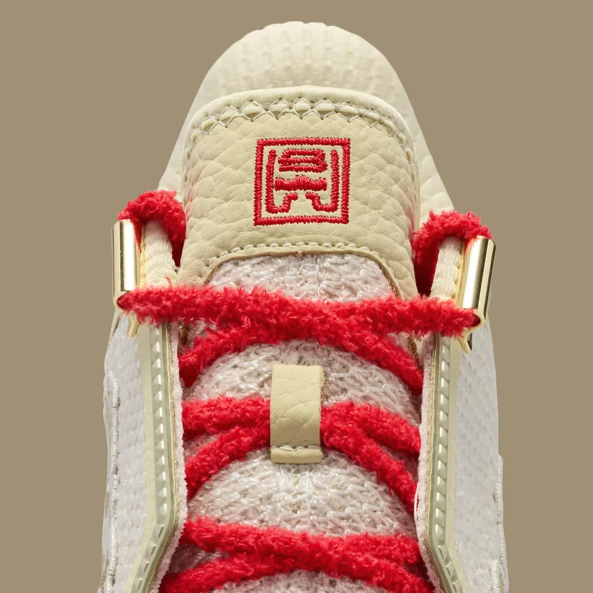 close-up of the tongue, red embroidered logo patch and red laces, Lunar New Year