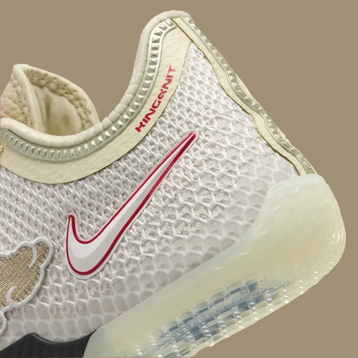 close-up of toe and swoosh, red logo text and icy translucent outsole, Lunar New Year