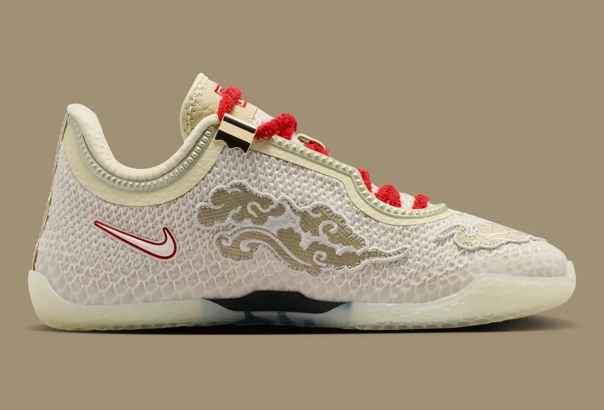 lateral view, tan cloud embroidery on cream mesh with red laces and gold trim, Lunar New Year