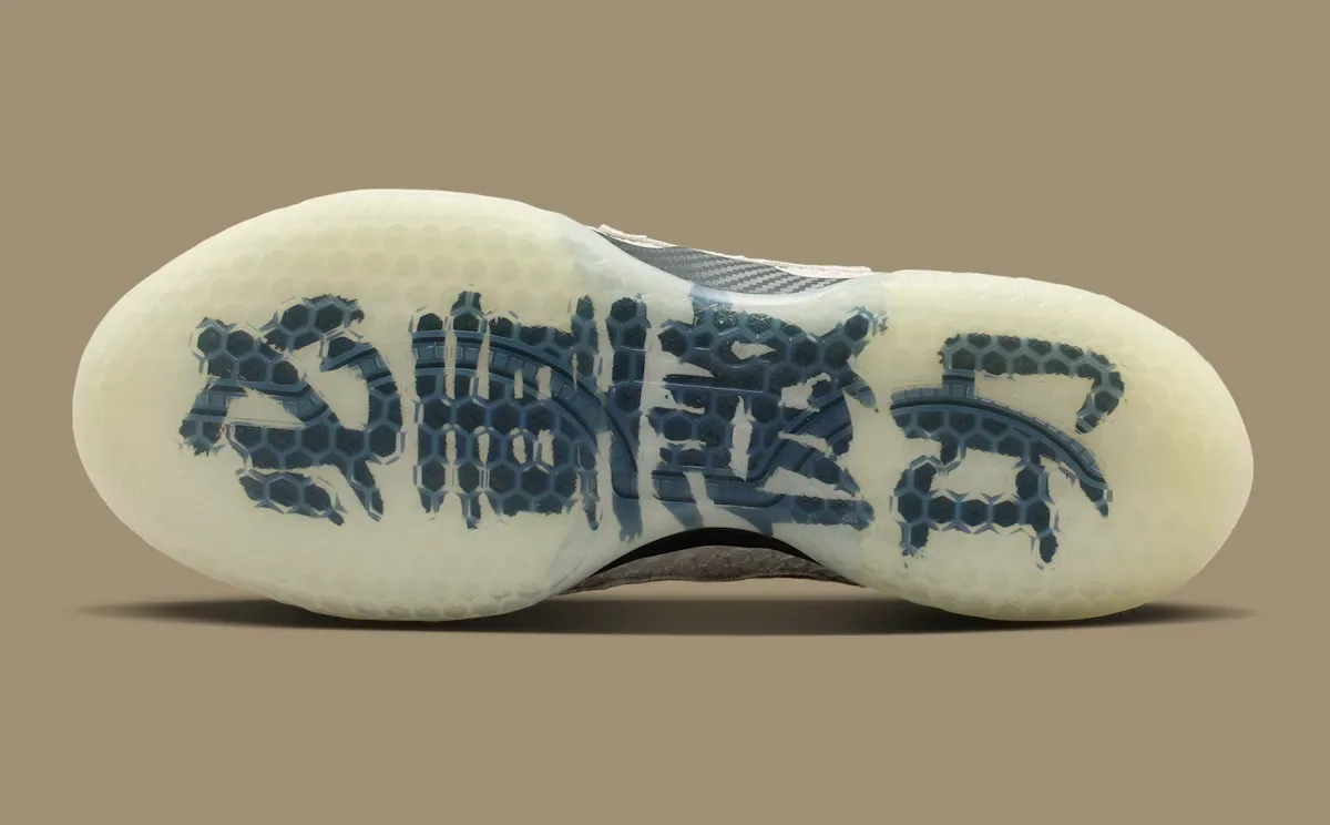 outsole view of one shoe, angled, blue Chinese characters on icy sole, Lunar New Year