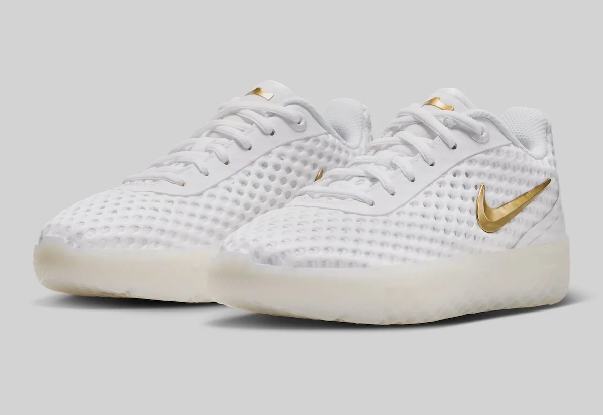 three-quarter pair, white mesh uppers with gold swooshes and pale soles, LeBron Witness 10