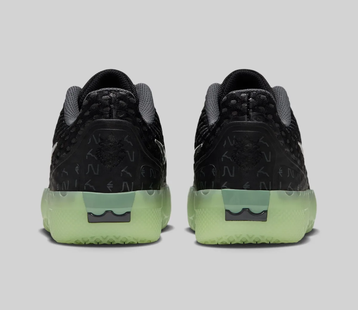heel view pair, black with grey crown emblem and mint translucent sole, LeBron Witness 10