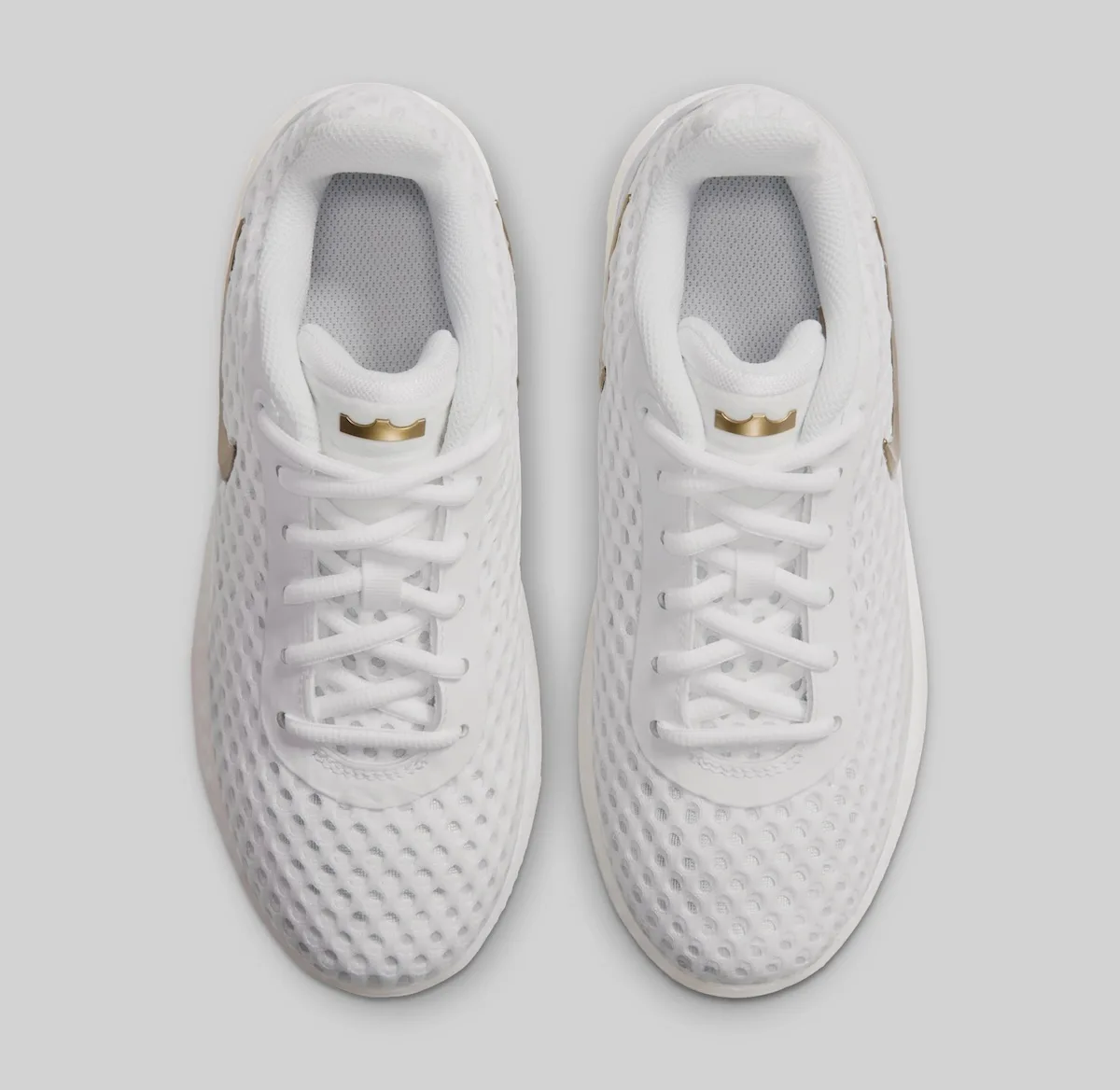 top-down pair, white mesh with gold crown tongue tabs and gold swooshes, LeBron Witness 10
