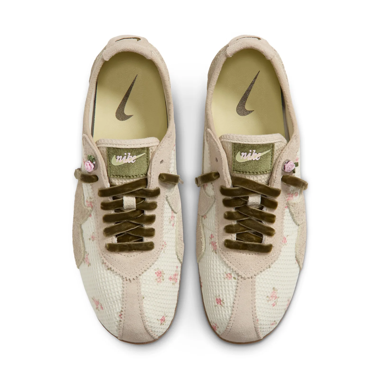 top-down view of pair, crossed olive laces, pink rose charms, tan sockliner swoosh, Floral Mesh