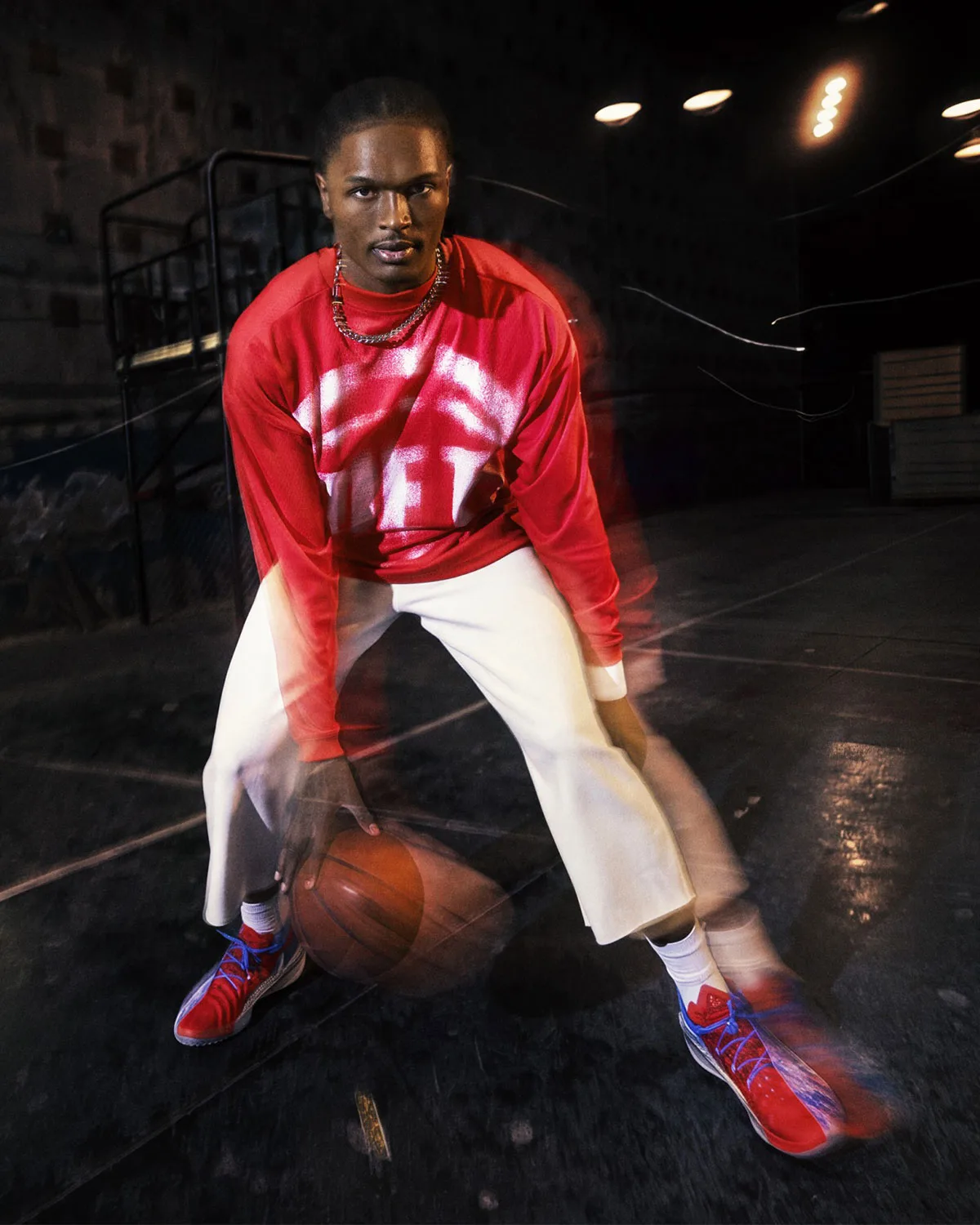 on-court, red spray-paint graphic top, white pants, red and blue basketball shoes, Standard Issue Collection