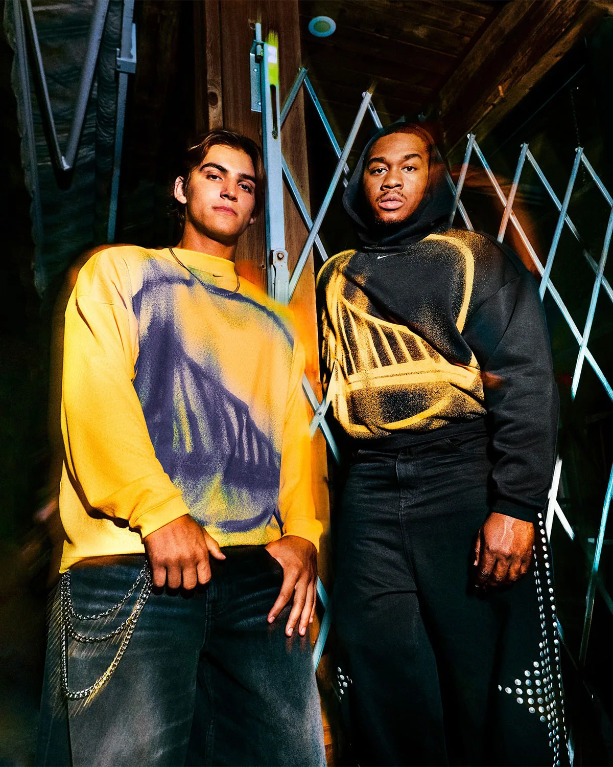 two models, yellow spray-paint graphic top and black spray-paint graphic hoodie, Standard Issue Collection