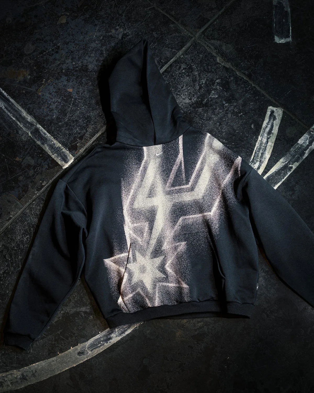 flat lay, black hoodie with white and pink spray-paint star graphic, Standard Issue Collection