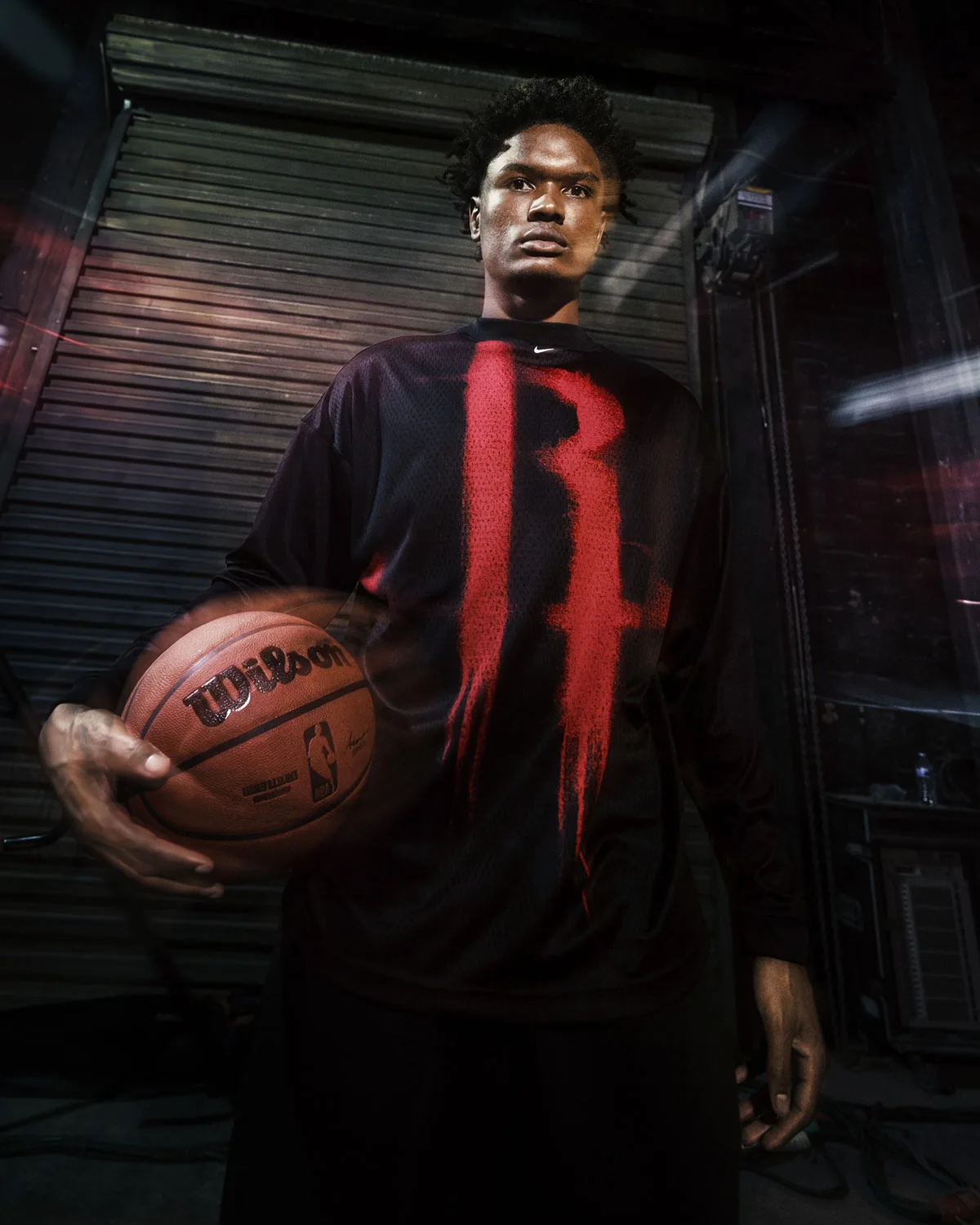on-body, black long-sleeve top with red spray-paint letter graphic, basketball in hand, Standard Issue Collection