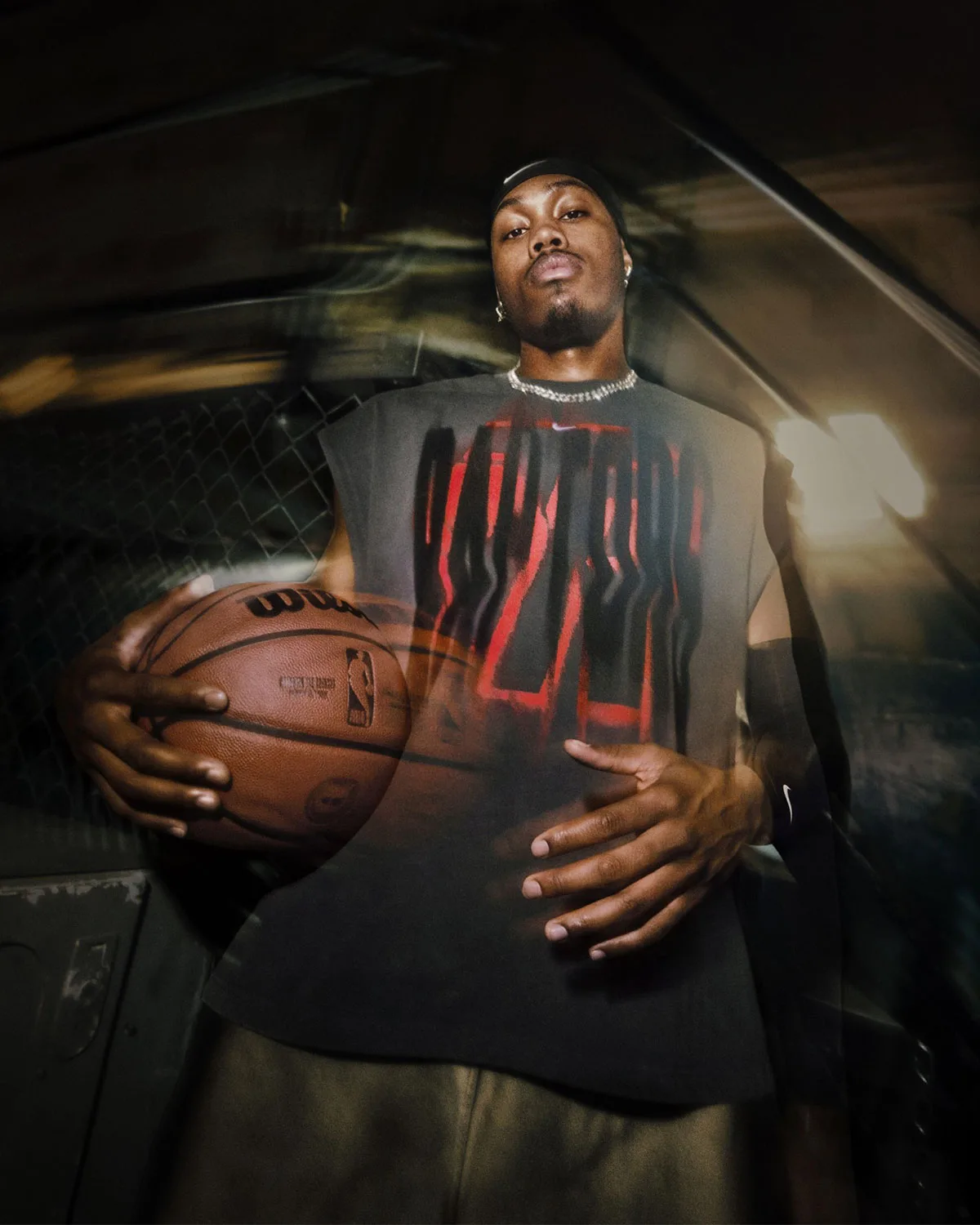 on-body, black sleeveless top with red spray-paint graphic, chain necklace, Standard Issue Collection