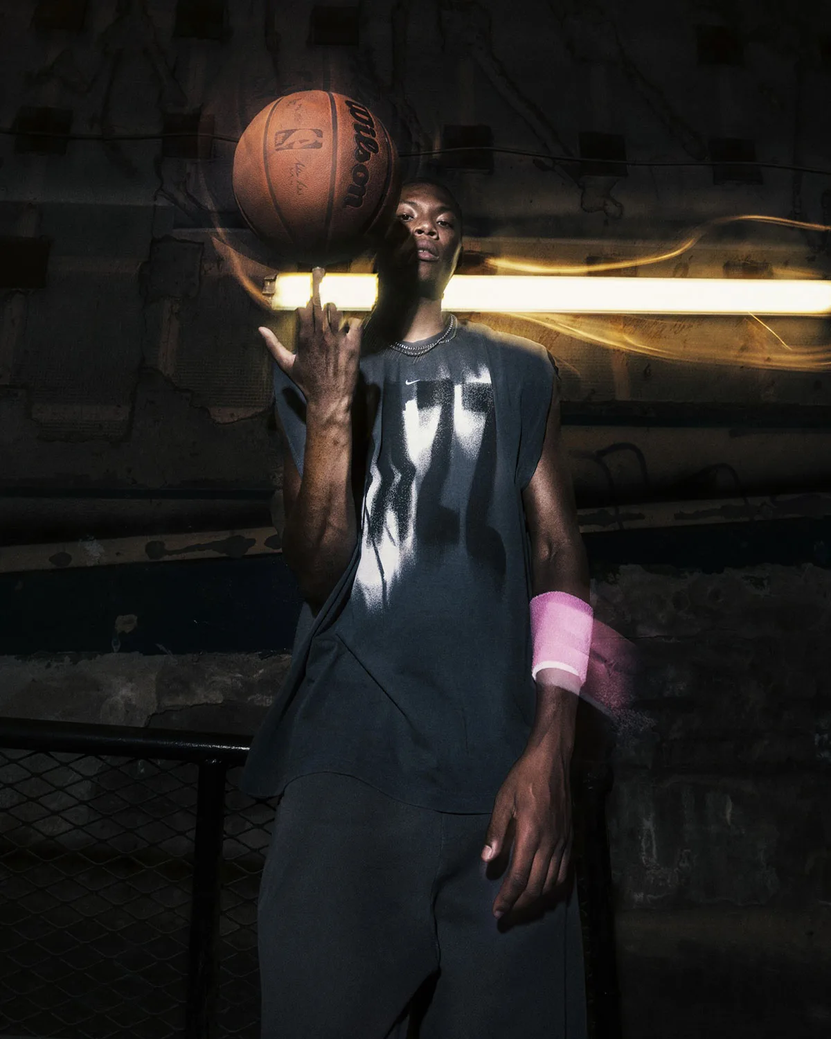 on-body, man spinning basketball on finger, black tee with white spray graphic, Standard Issue Collection