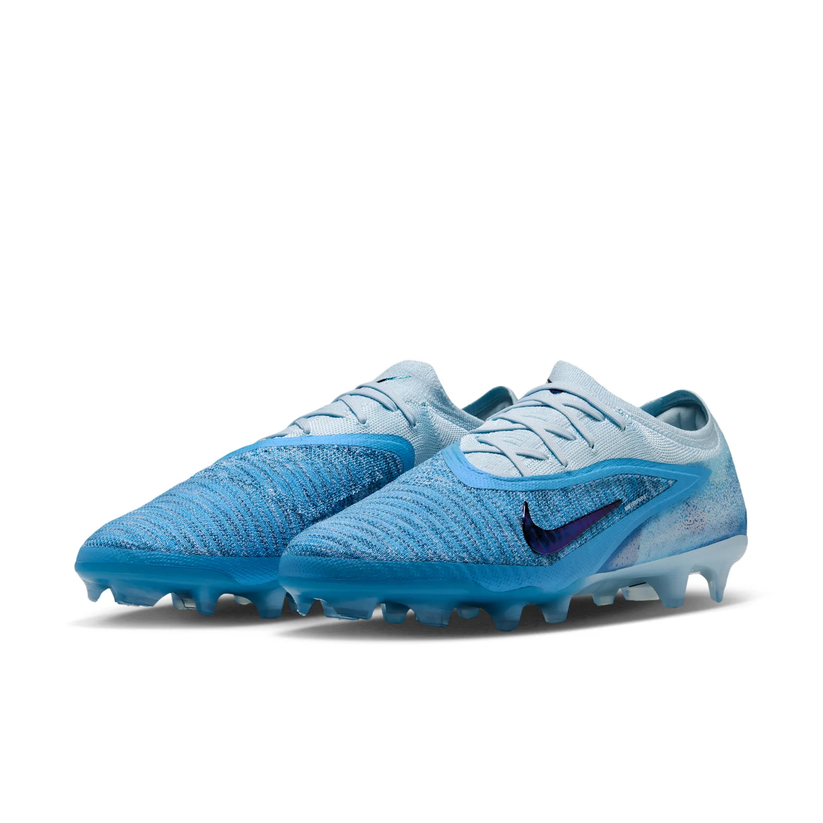 front three-quarter pair view, white upper fading to blue, purple swoosh, studs, Baltic Blue