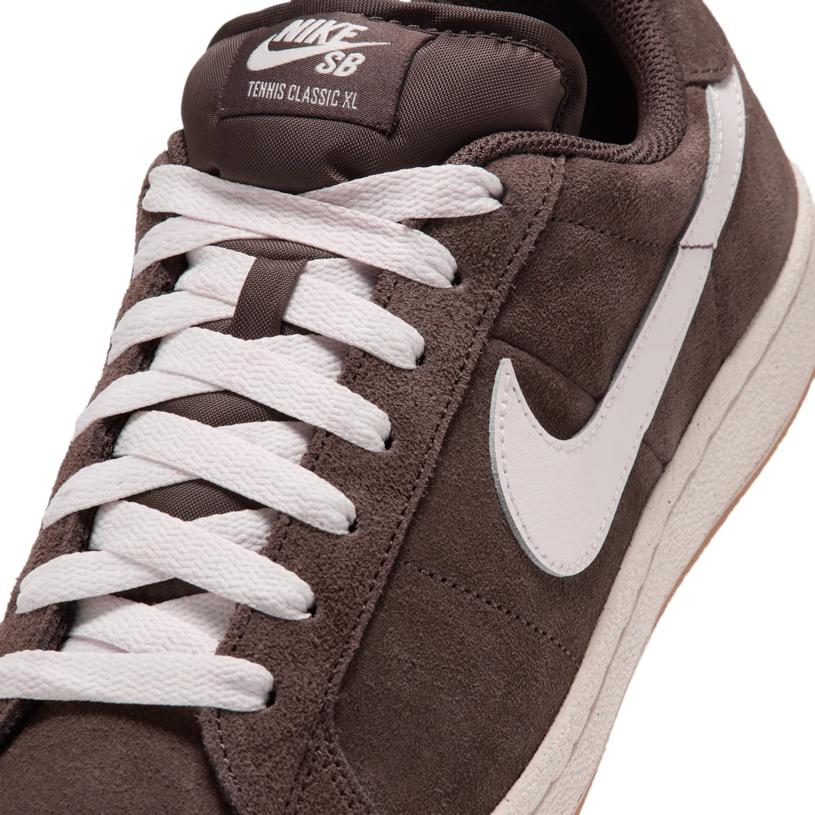 Close-up of tongue and swoosh, NIKE SB tag reads Tennis Classic XL, white laces, Baroque Brown
