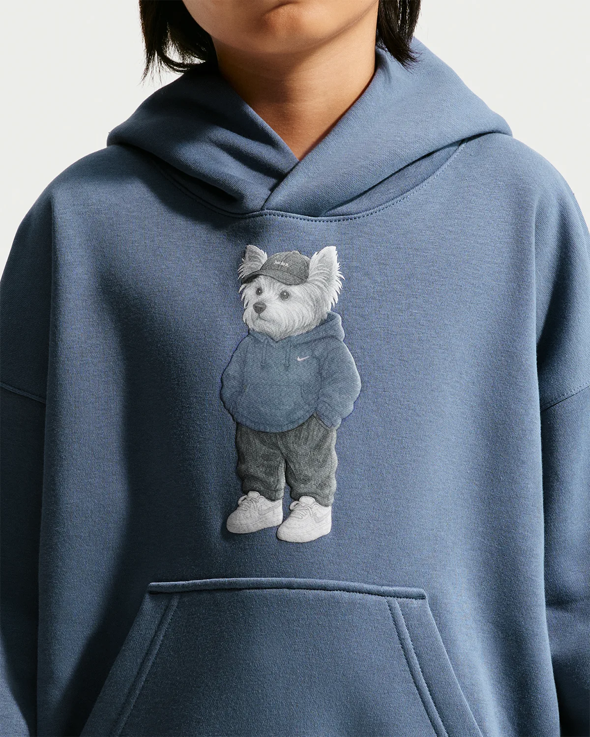 close-up chest detail, blue hoodie with grey dog-in-hoodie graphic and drawstring hood, Shoe Dog