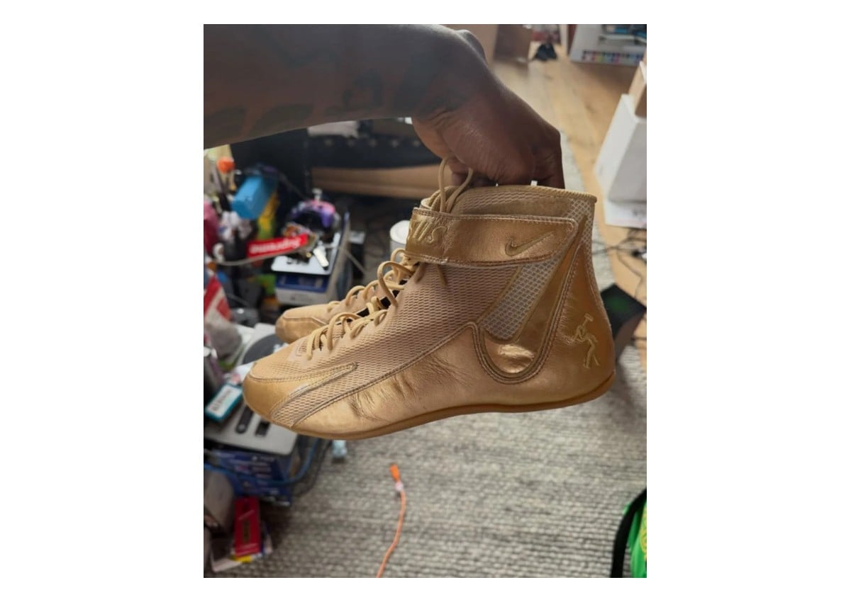 held in hand, medial view, gold leather and mesh high-top with Nike swoosh, Nike Speedsweep 8
