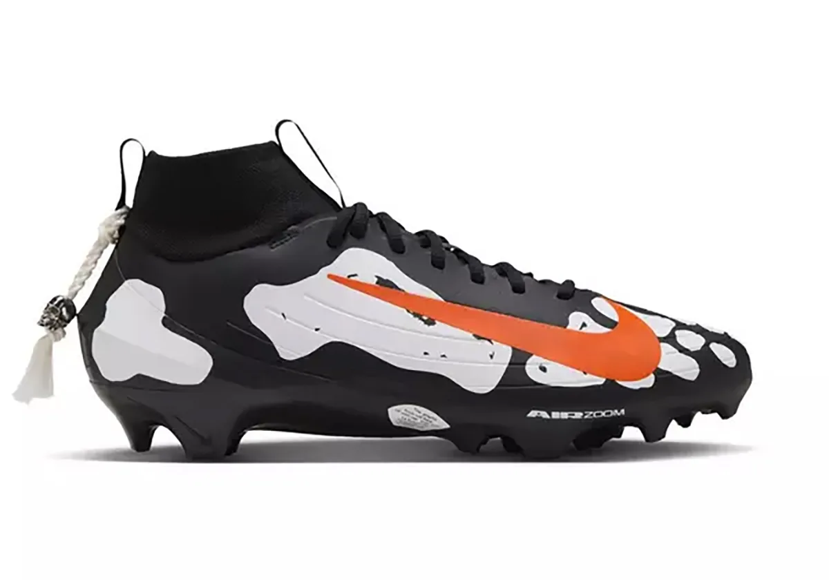 medial view, skeletal bone print with orange swoosh and heel skull charm lace tag, Skeleton