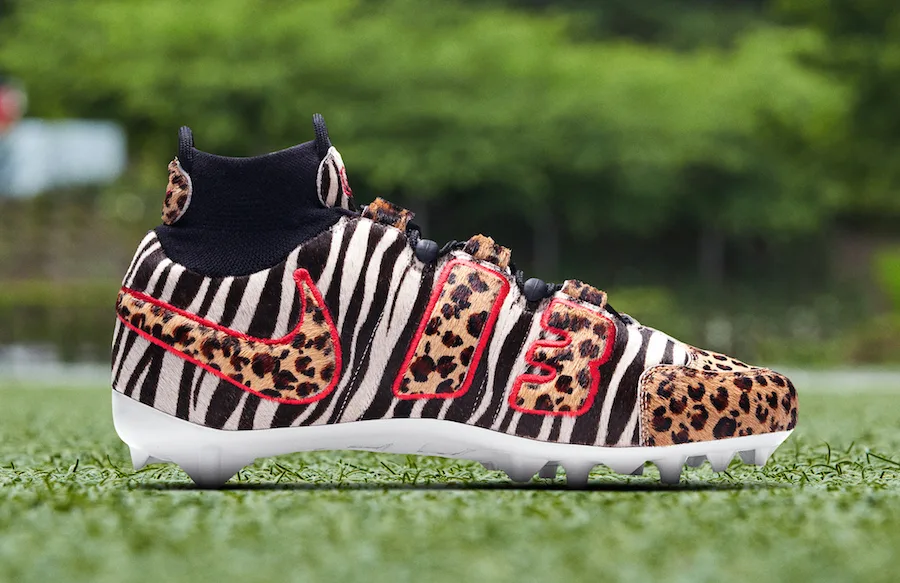 lateral view, zebra and leopard calf-hair upper with '13' in leopard print, white outsole, OBJ Uptempo Cleat