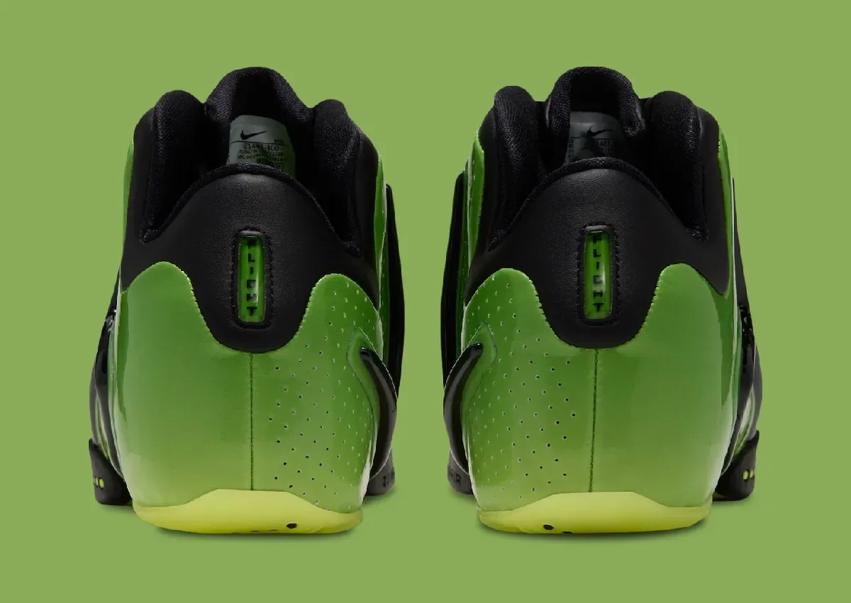 heel view of a pair, black collars with green 'LI-GHT' tab and yellow outsoles, Green Apple
