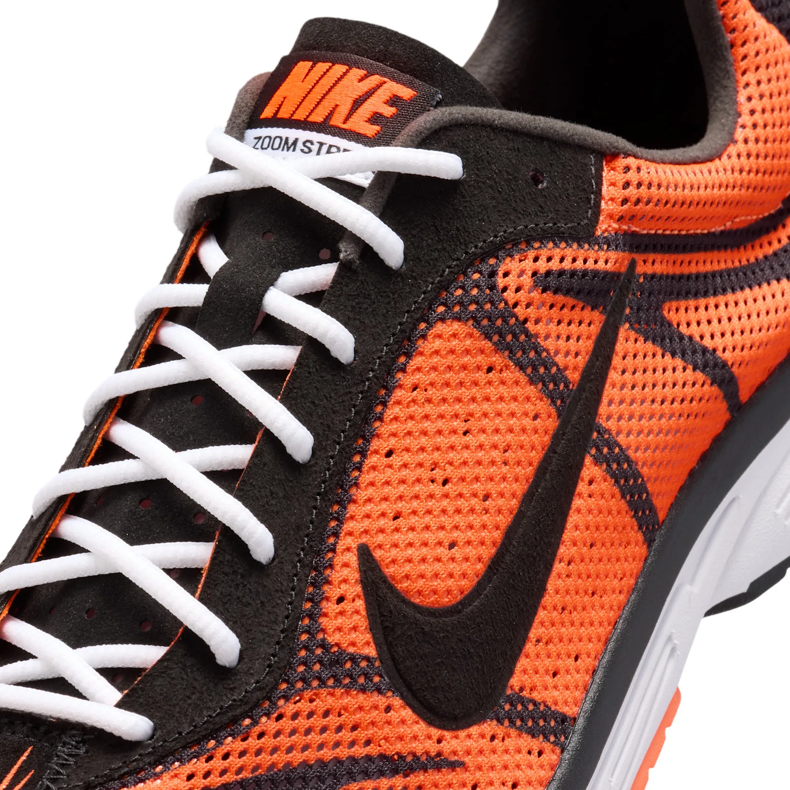close-up of toe box and laces with black swoosh on orange mesh upper, Safety Orange