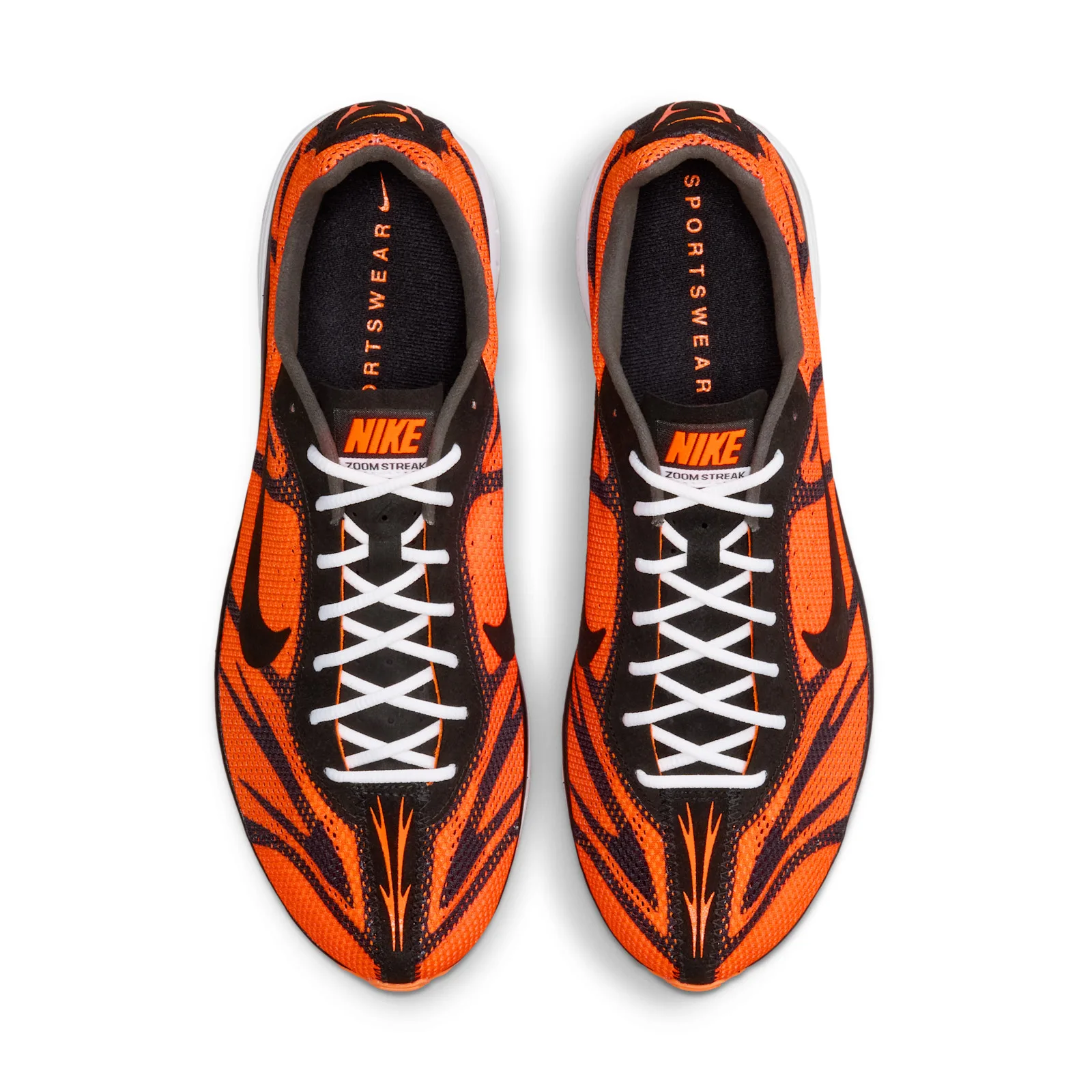 top-down pair view showing black tongue tab with orange Nike logo and laces, Safety Orange