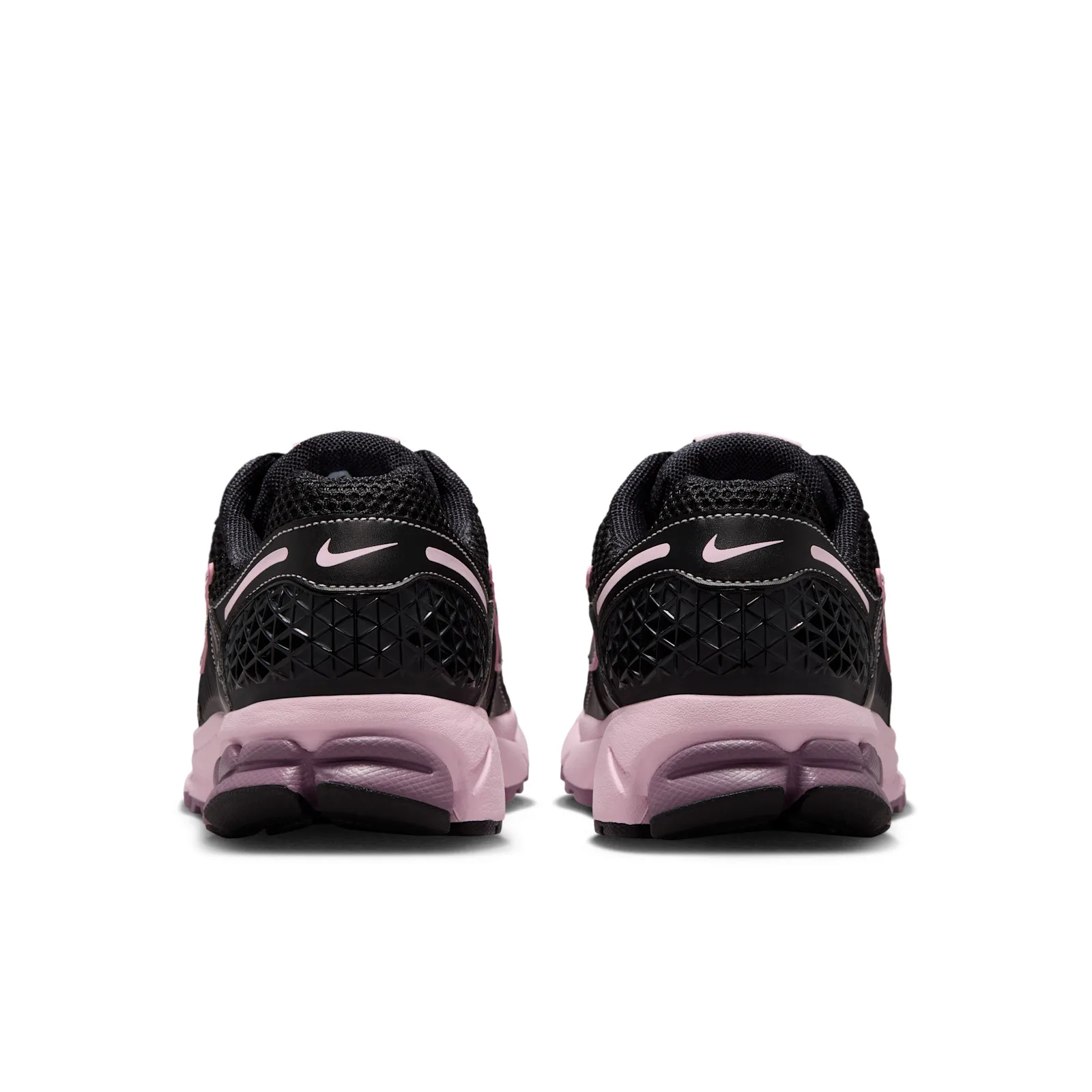 outsole close-up showing pink and mauve tread blocks with black lugs, Black/Pink Foam