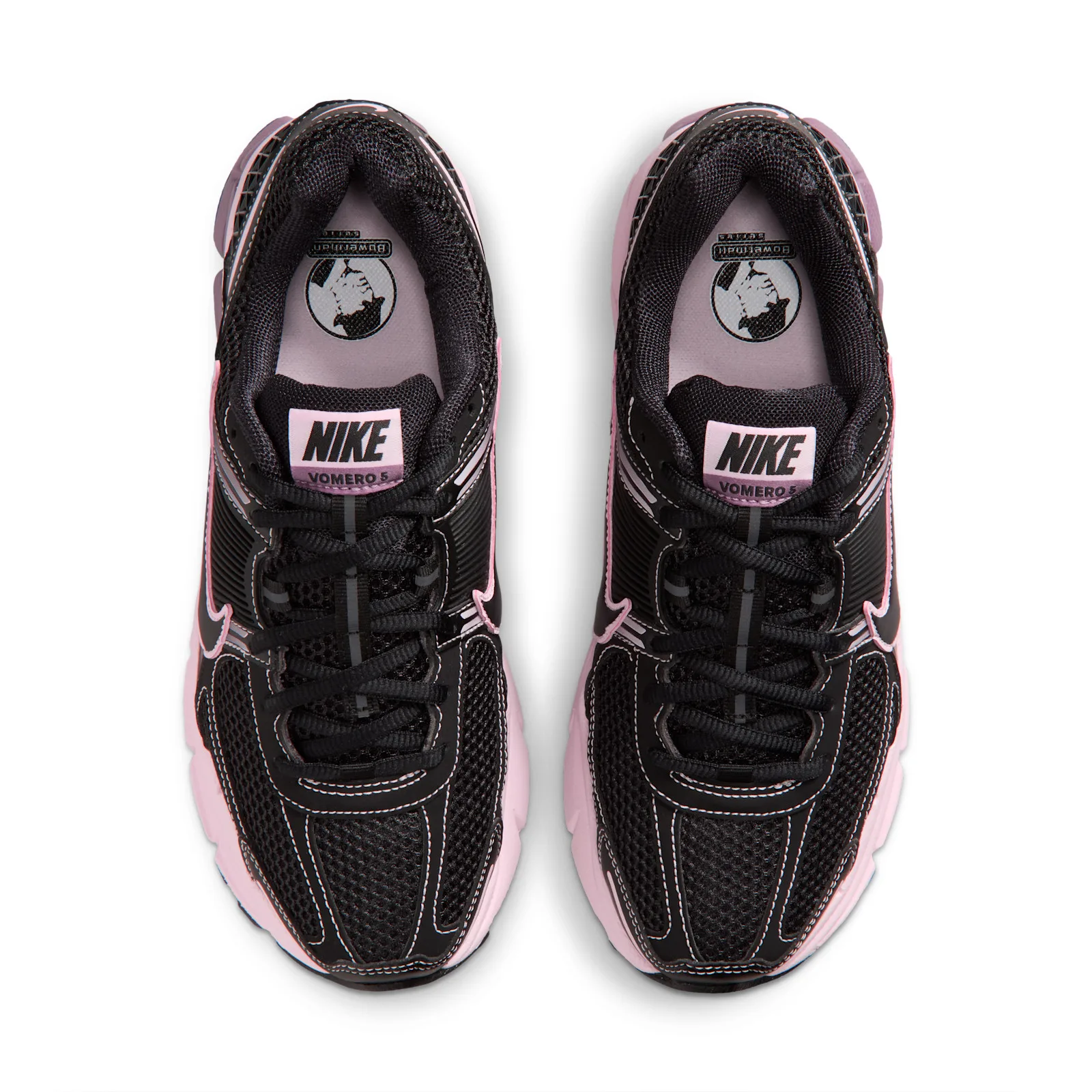 top-down pair view showing black mesh tongues with pink Nike Vomero 5 tags, Black/Pink Foam