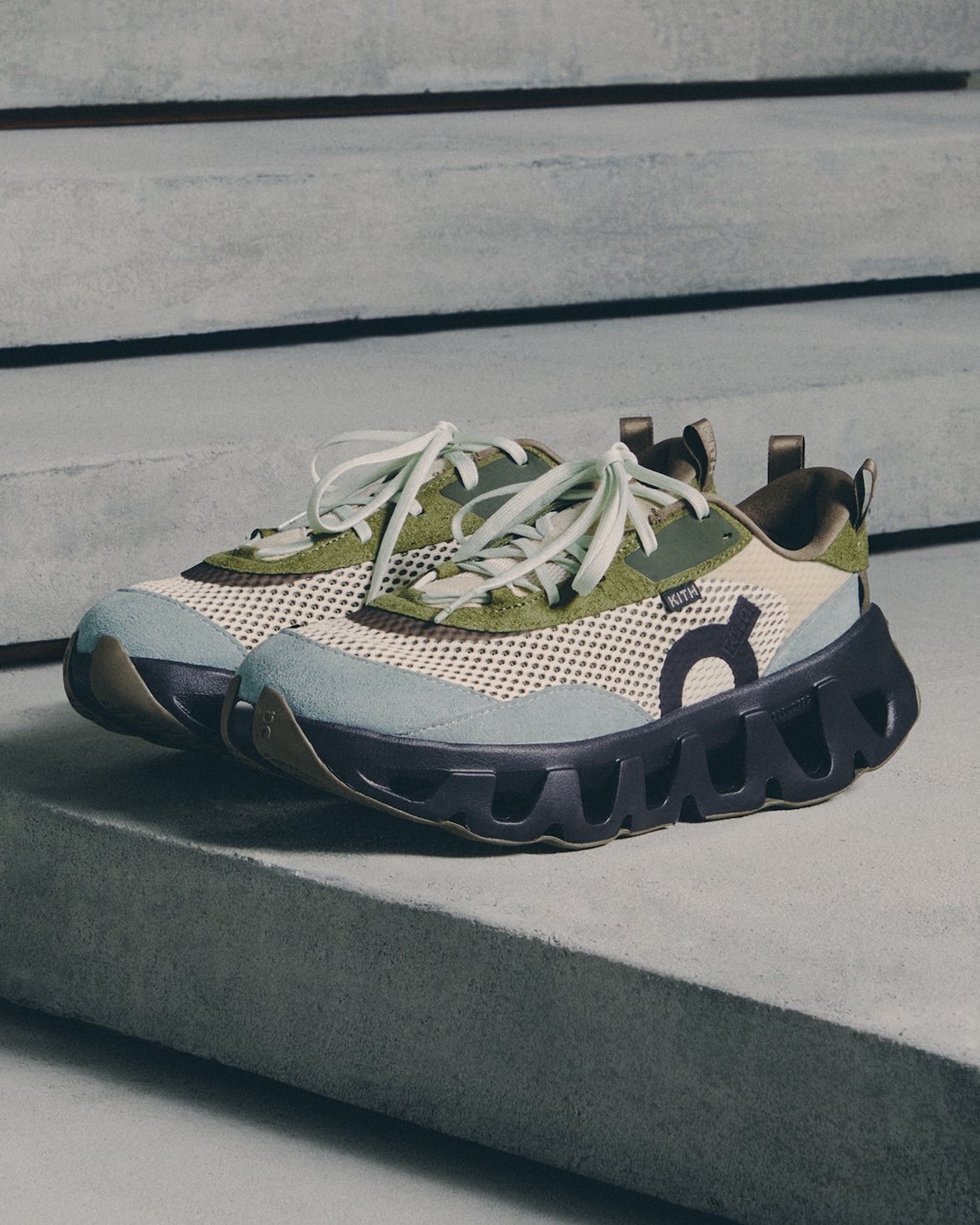 lateral shoe, cream mesh with olive green and light blue panels, KITH tag, K Tech 3