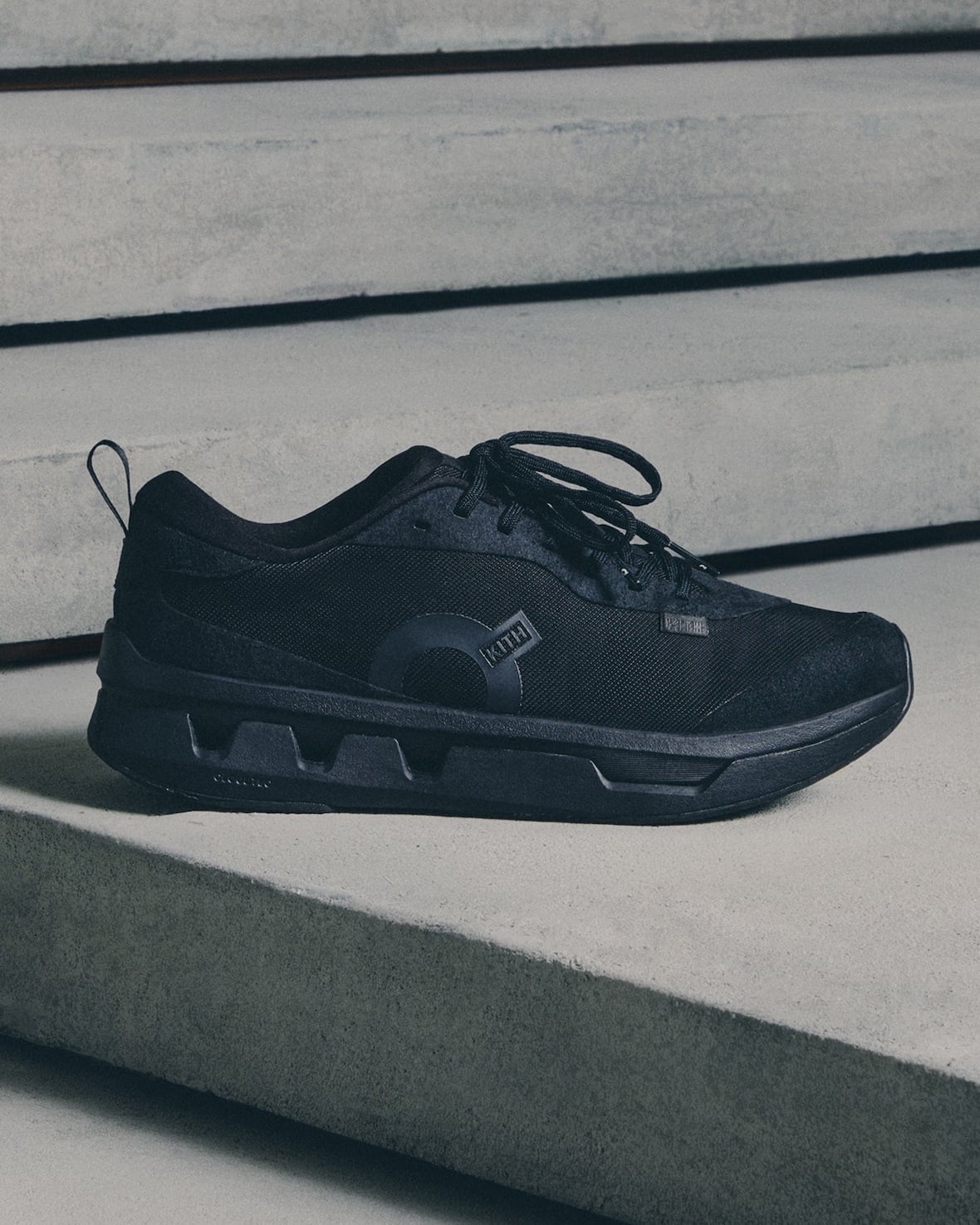 lateral shoe, all-black upper with KITH logo and black cutout outsole, K Tech 3