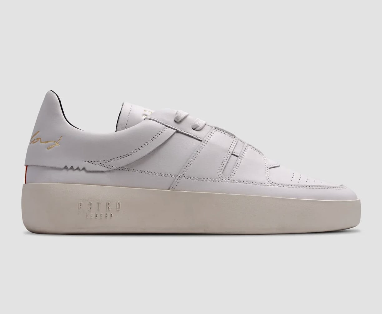 Lateral view, white leather upper, gold logo, black heel lining, cream sole, P3TRO Legend
