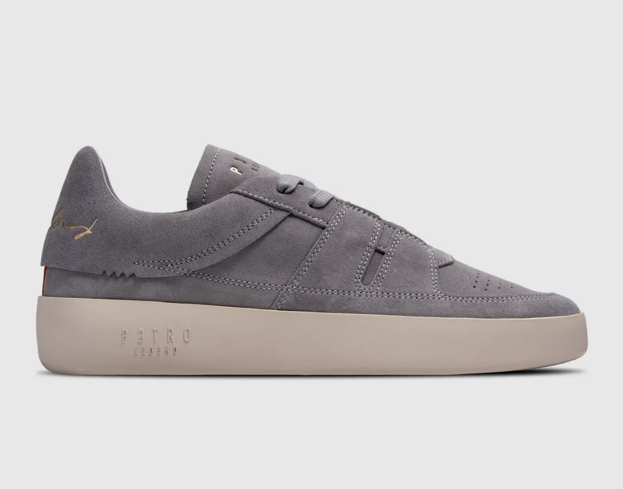 Lateral view, grey suede upper, gold signature logo, cream embossed sole, P3TRO Legend
