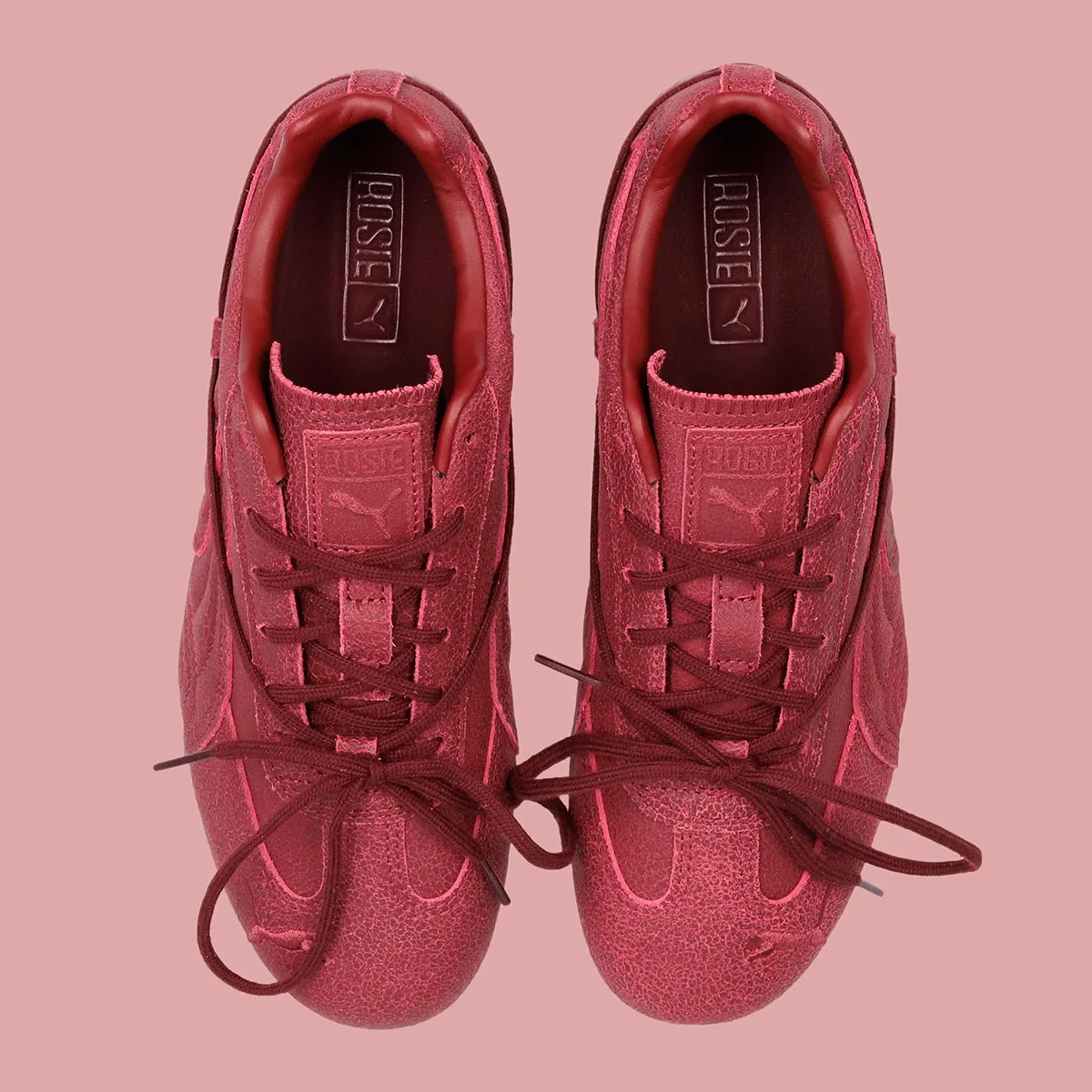 top-down burgundy pair showing rosie-branded tongue tags and puma logo, OG x Rosé