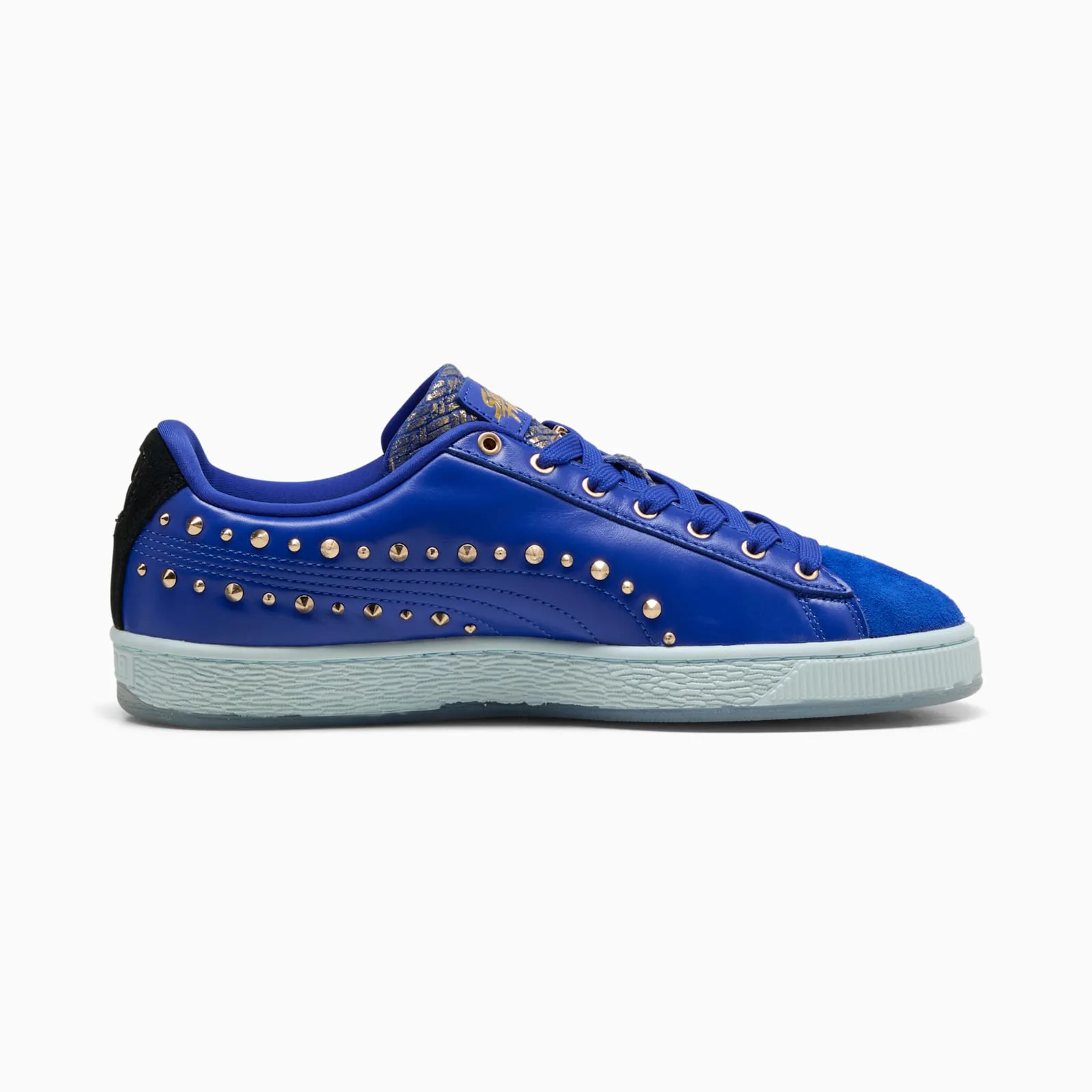 lateral side view highlighting gold tongue logo and stitched blue leather panel, Chun Li