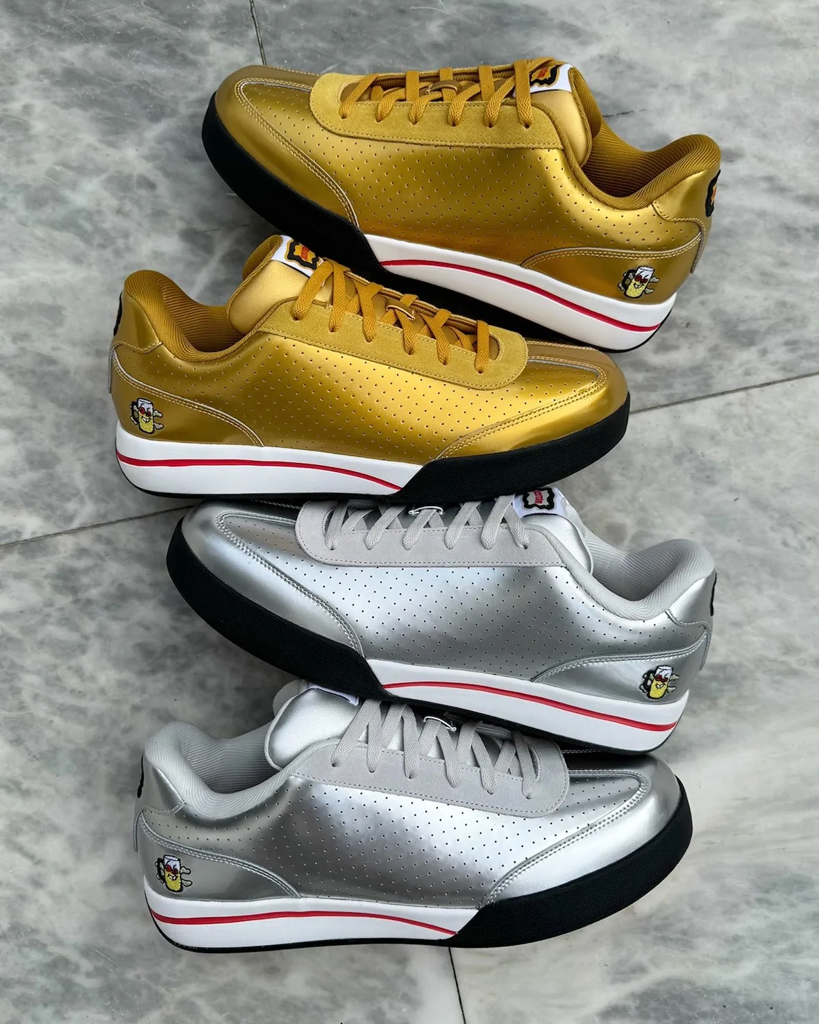 stacked lateral pair shot, gold sneakers atop silver, red midsole stripe, Japanese Beer Pack
