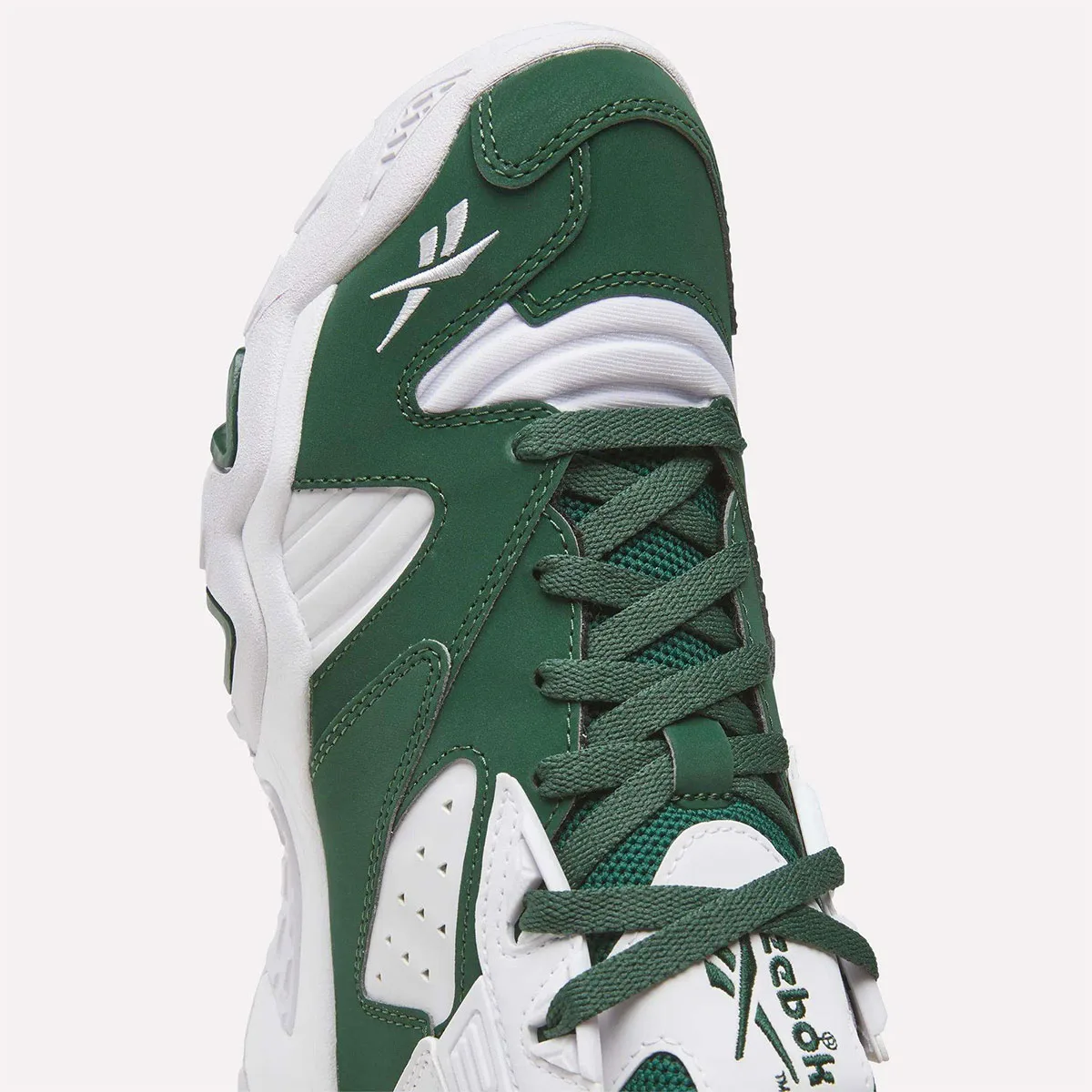 close-up toe and lacing detail, dark green leather with white Reebok vector logo, Reebok Brutus Lo