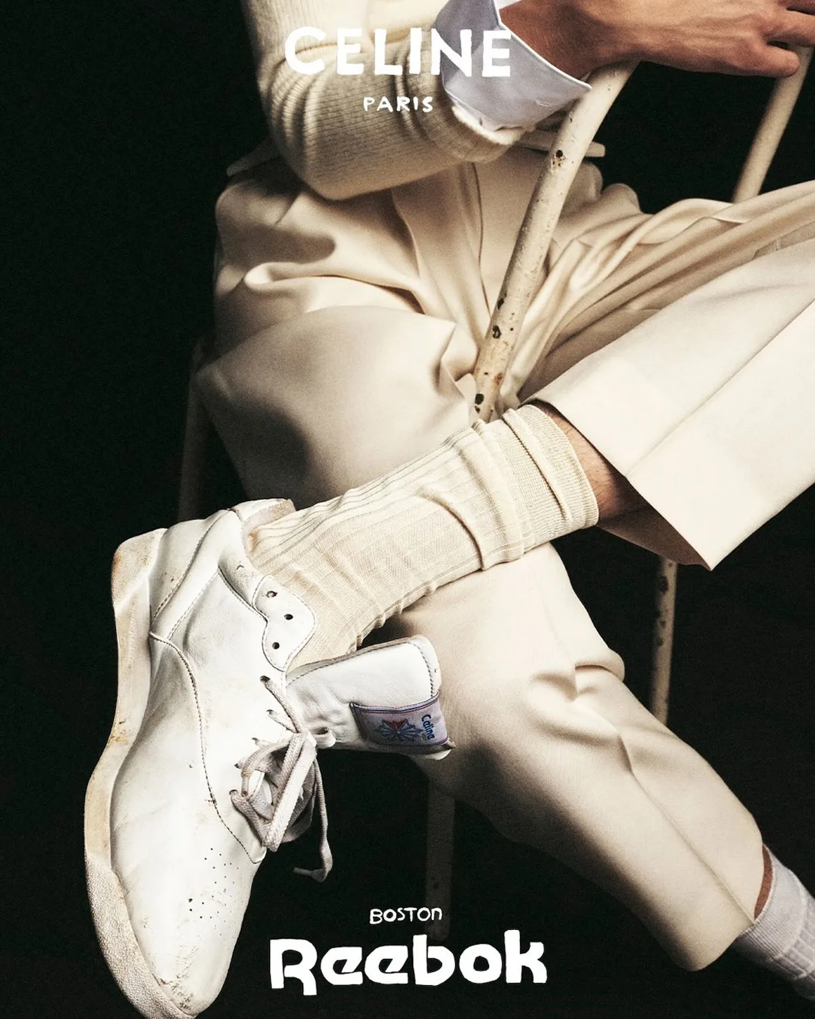 On-foot, worn cream sneakers with 'Boston Reebok' text, Lo x Celine