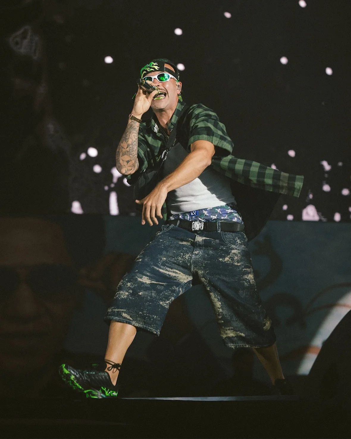 on-foot, worn on stage by performer in green plaid shirt and denim shorts, NEXXT x Feid