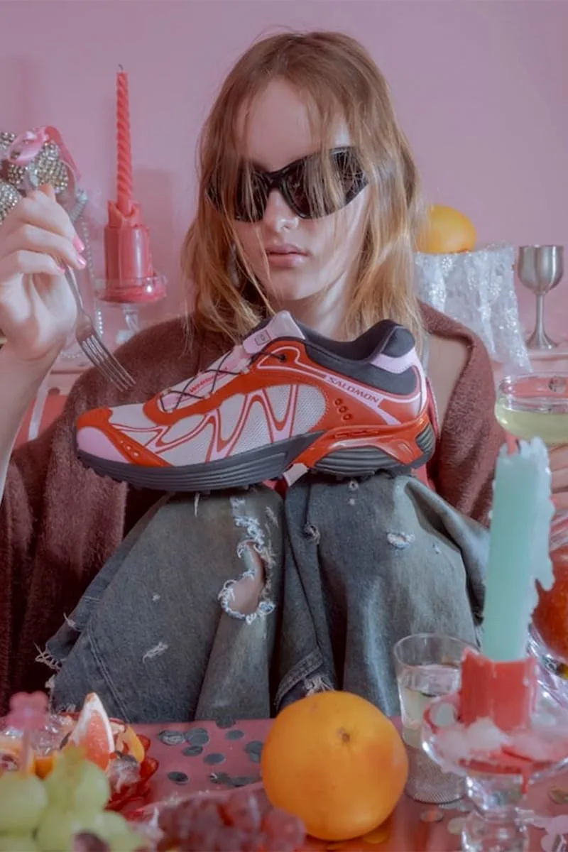 in-hand lateral view on model's lap beside oranges and candles at a table, Cherry Cake Party