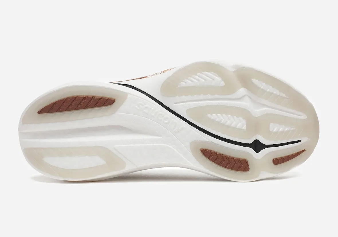 outsole view, white sole with orange traction pods and saucony text, Space Cowboy