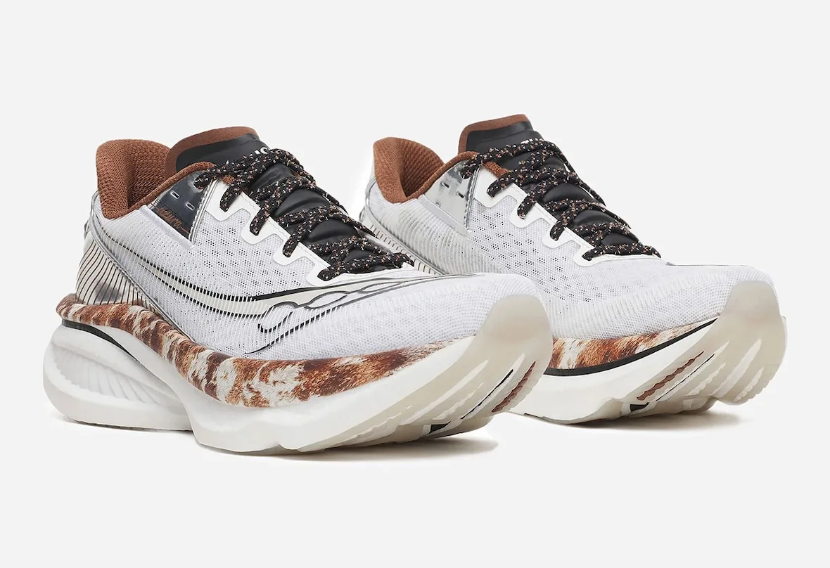 front-angled pair, white mesh uppers with black laces and cowhide-print midsoles, Space Cowboy