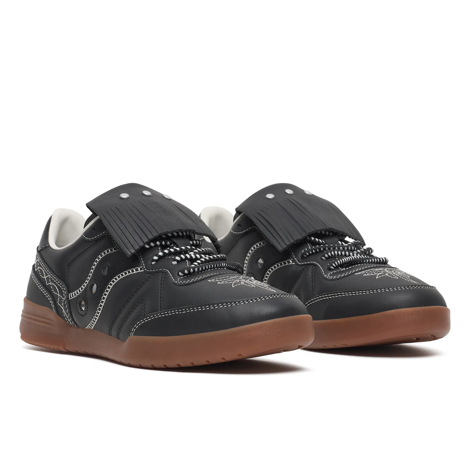 front-angled pair, black leather court shoes with fringed tongues and gum soles, Space Cowboy