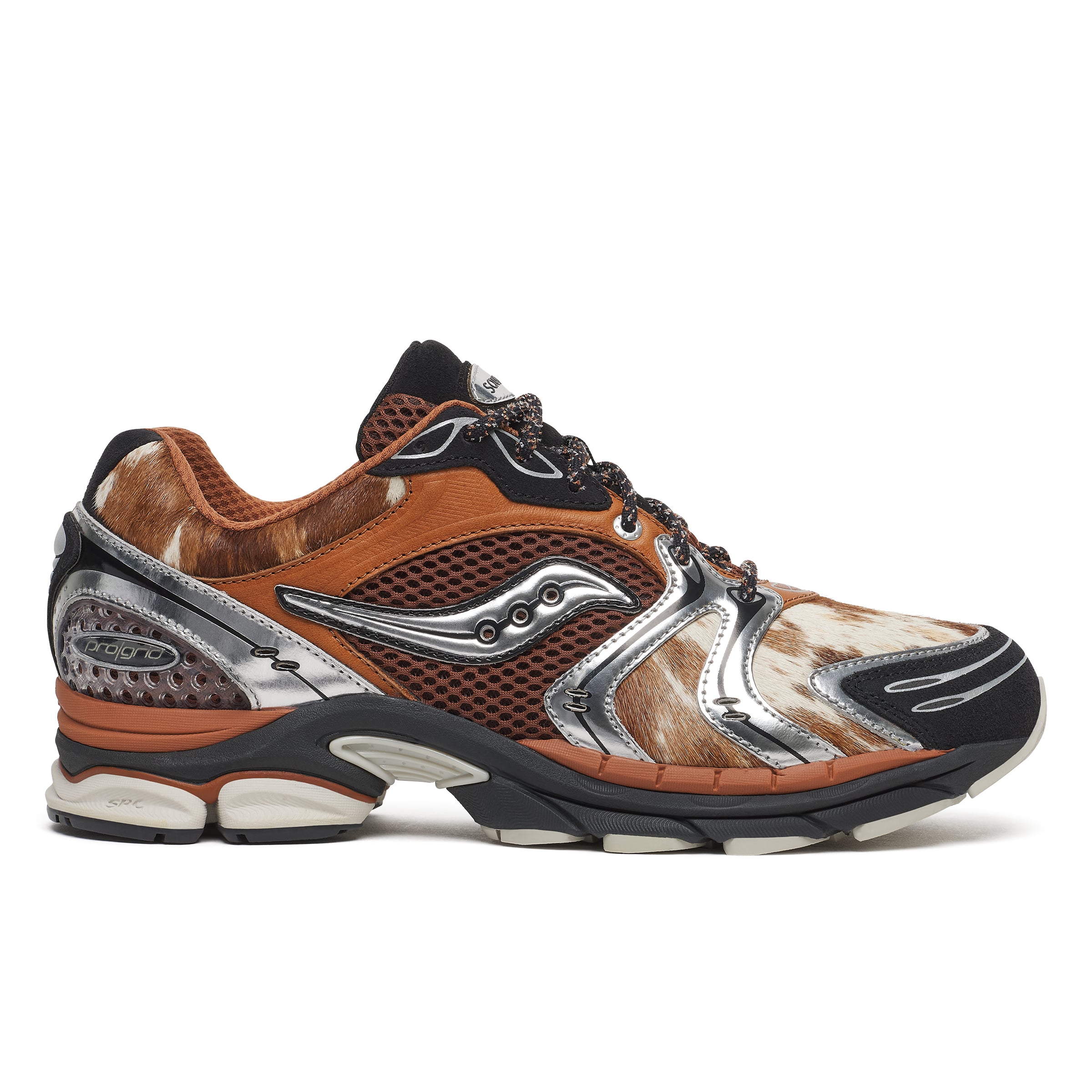 side view, tan leather upper with cowhide fur panels and silver overlays, Space Cowboy