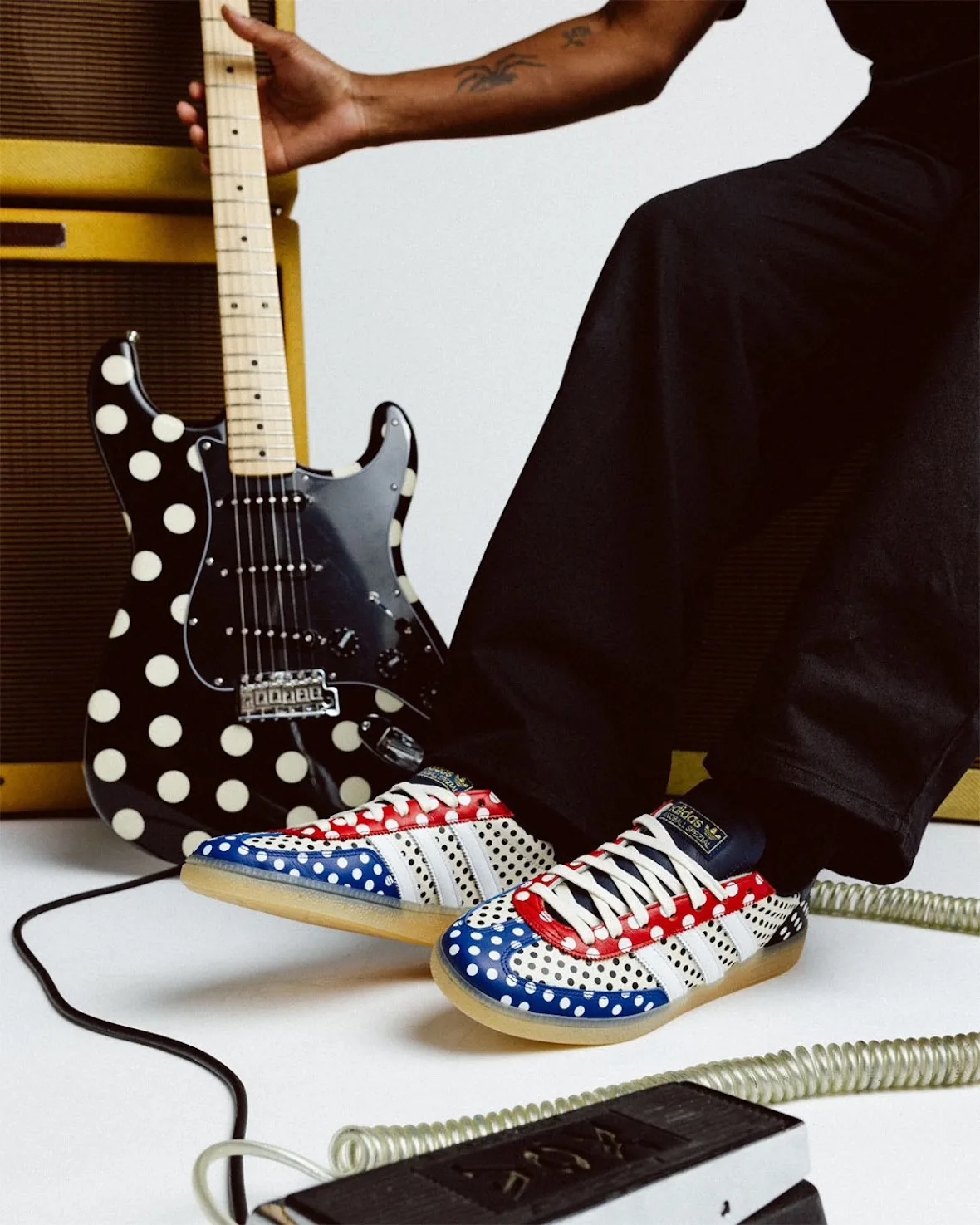 on-foot pair, one shoe resting on polka-dot guitar body, gum sole visible, Polka Dot
