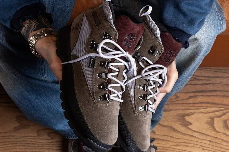 Close-up in hand, taupe suede boot with burgundy tongue and white laces, Euro Hiker GTX